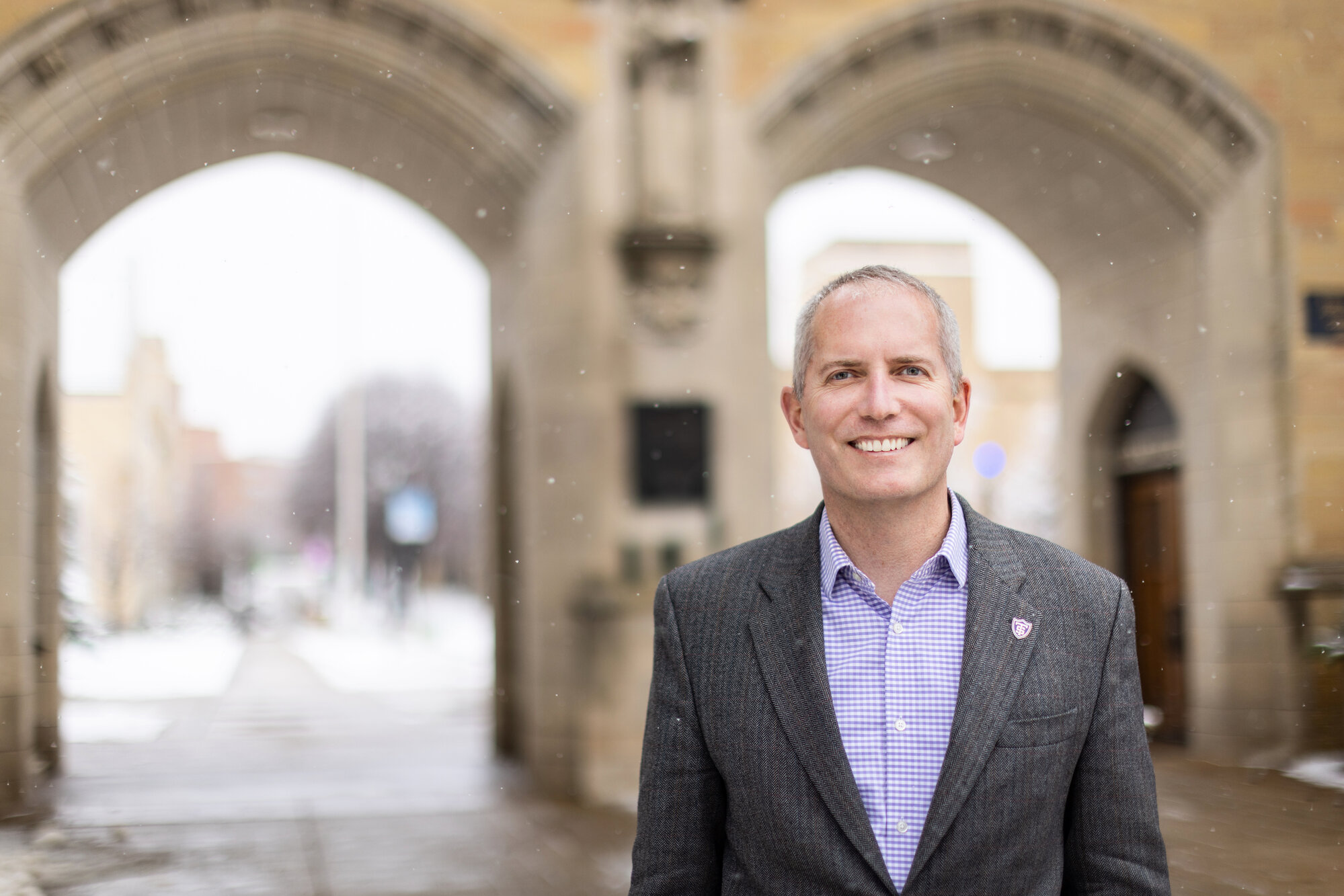 President Rob Vischer standing in front of the st thomas arches